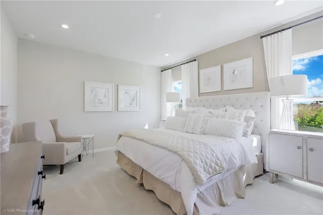 a bedroom with a bed and a couch