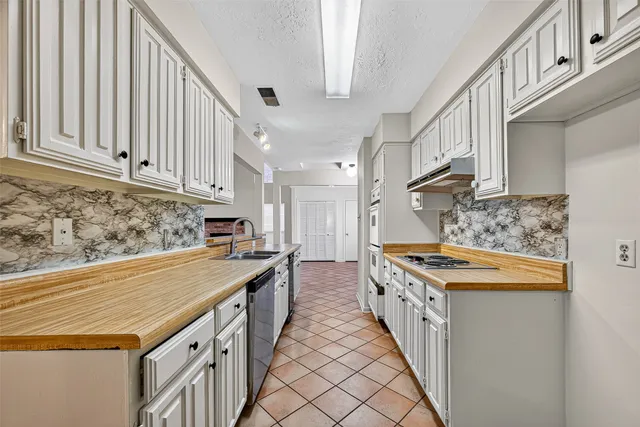 a view of an empty room with windows