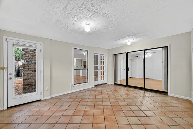 a view of an empty room and wooden floor