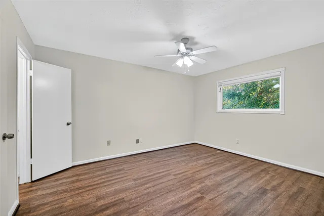 a bathroom with a sink a toilet a mirror and shower