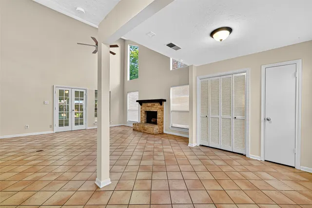 a view of a livingroom with wooden floor and fireplace