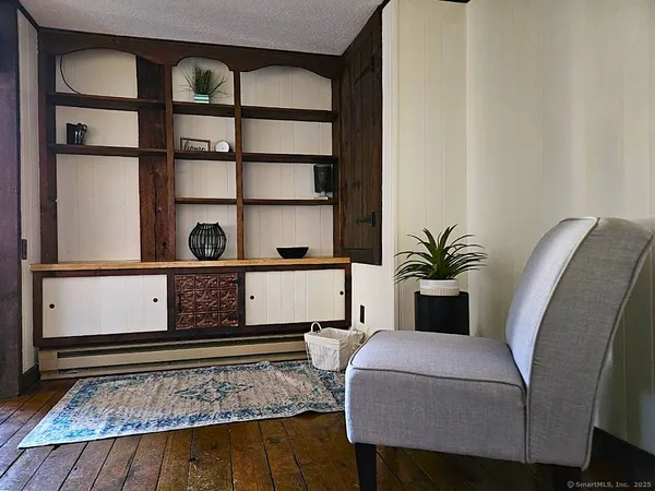 a living room with furniture and a rug