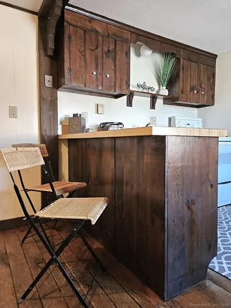 a view of a kitchen area with furniture and a window