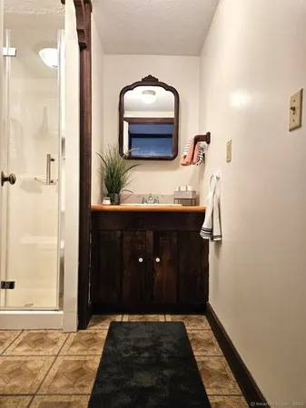 a bathroom with a sink and a mirror