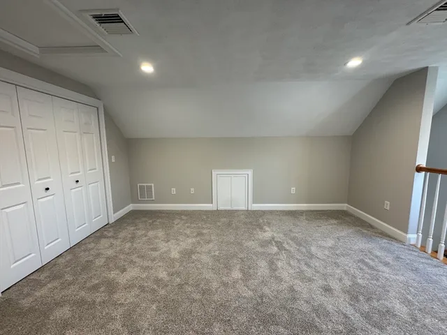a view of an empty room and a window