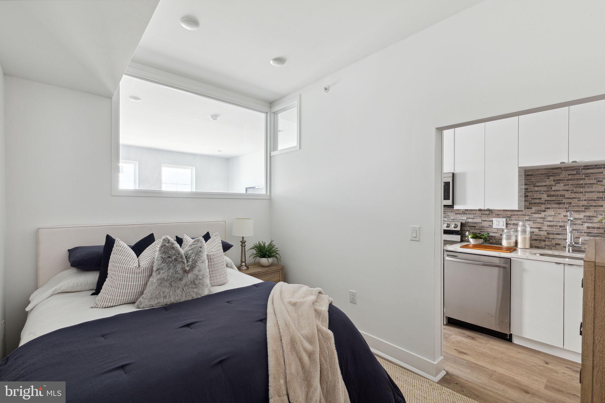 1439 Federal Street, Unit 211 Philadelphia, PA 19146 - Photo 10 of 21 a kitchen with a sink and cabinets