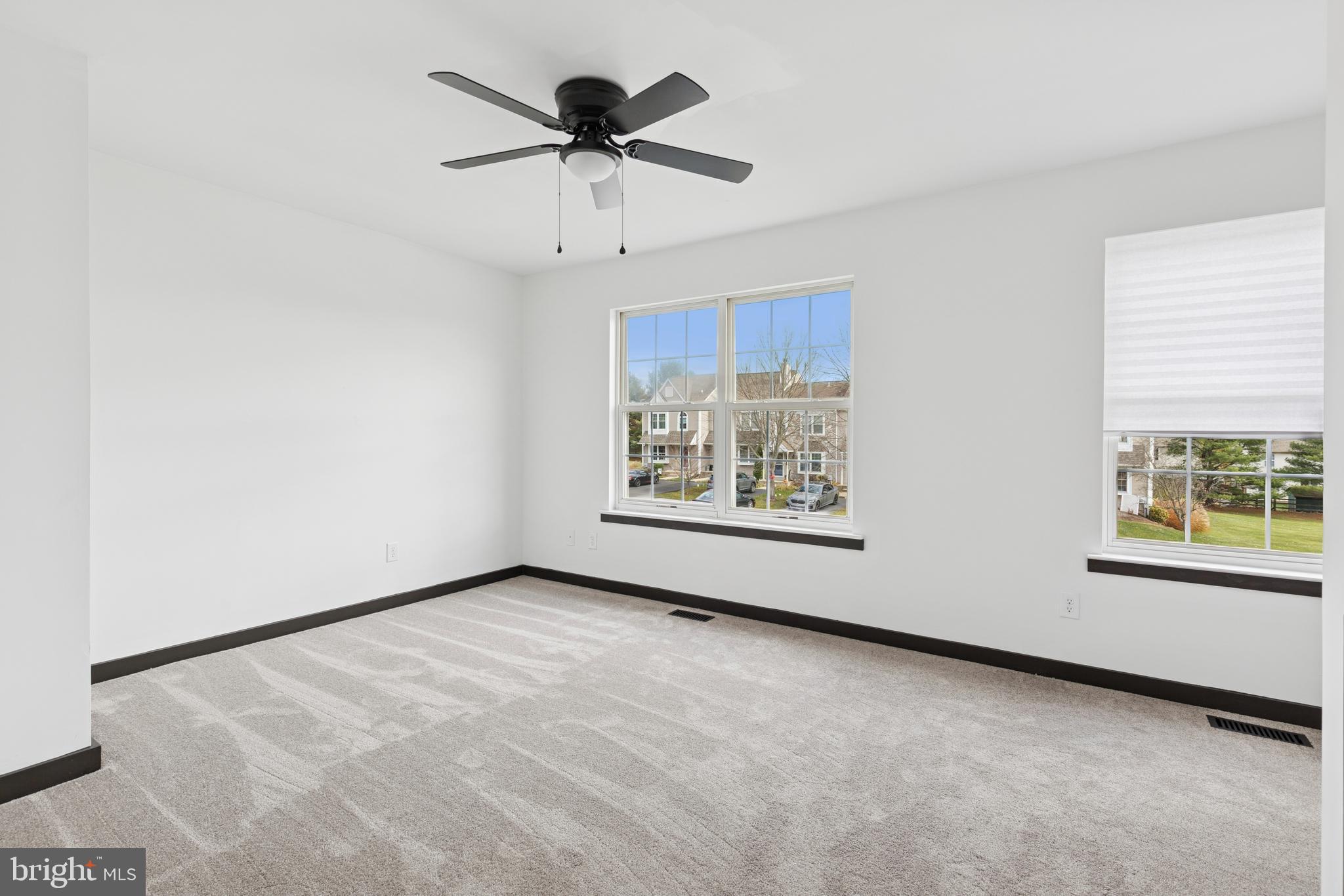 615 Longwood Road Collegeville, PA 19426 - Photo 14 of 25 an empty room with windows and ceiling fan