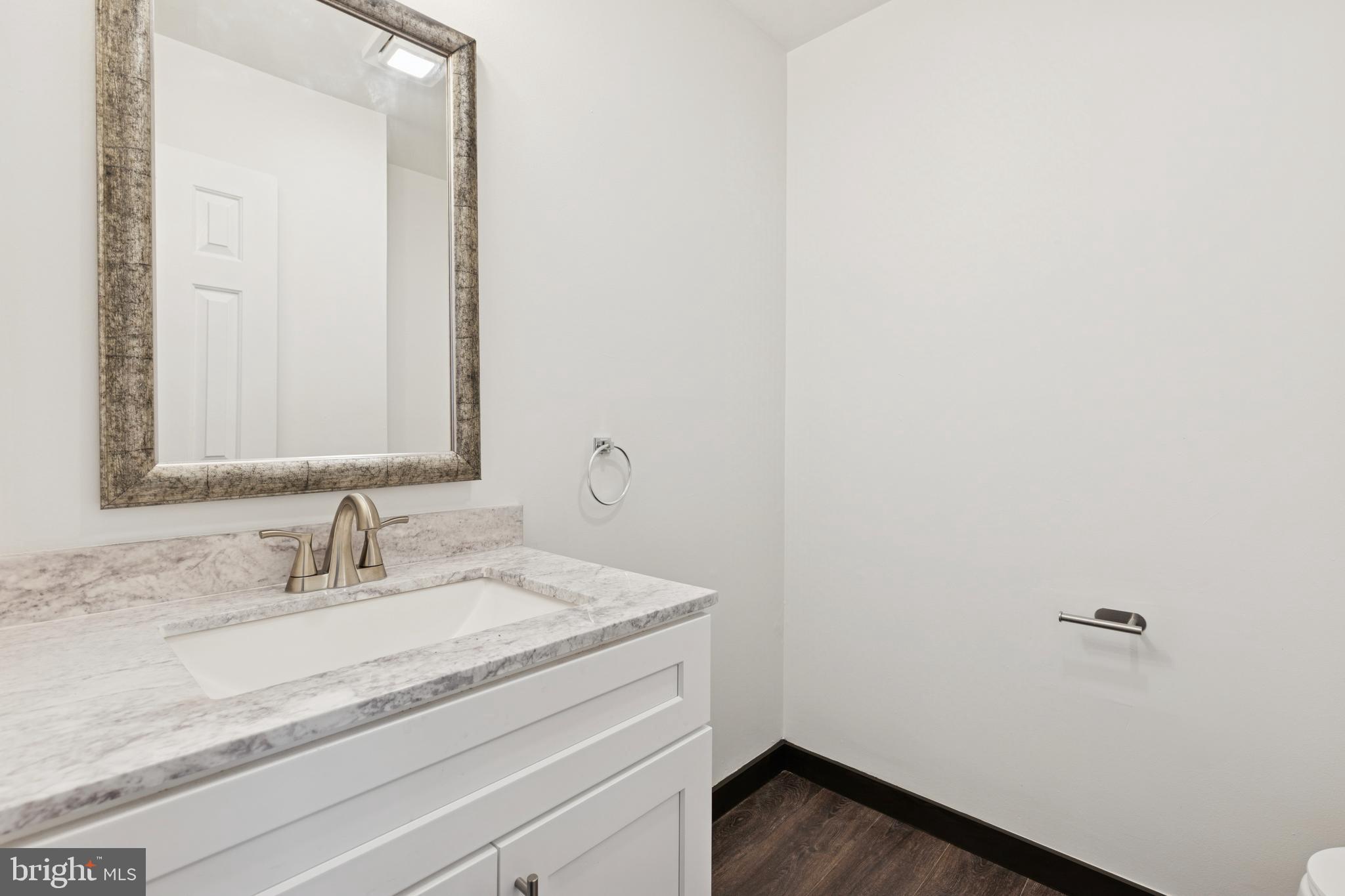 615 Longwood Road Collegeville, PA 19426 - Photo 18 of 25 a bathroom with a sink and a mirror