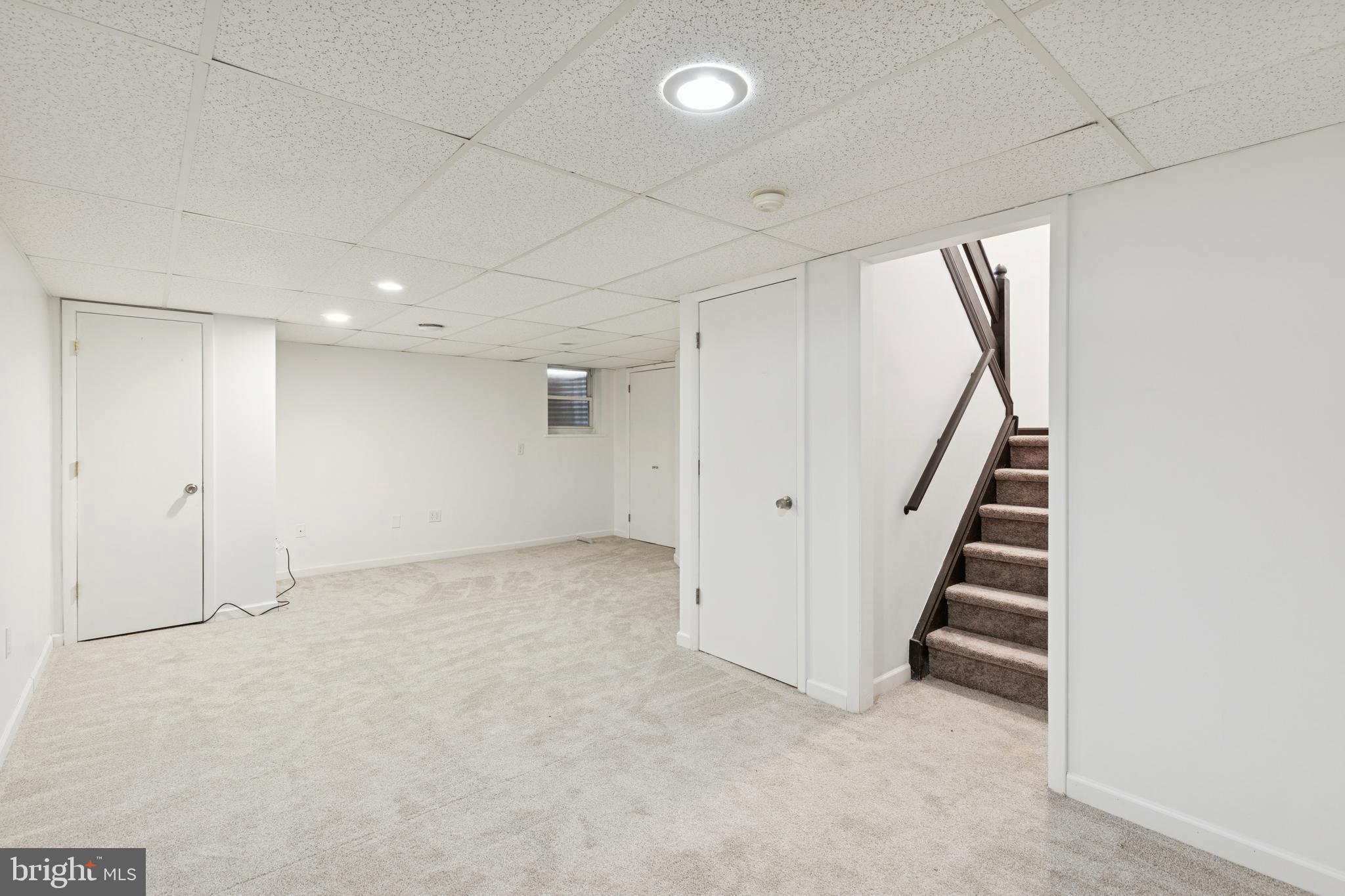 615 Longwood Road Collegeville, PA 19426 - Photo 20 of 25 an empty room with staircase and white walls