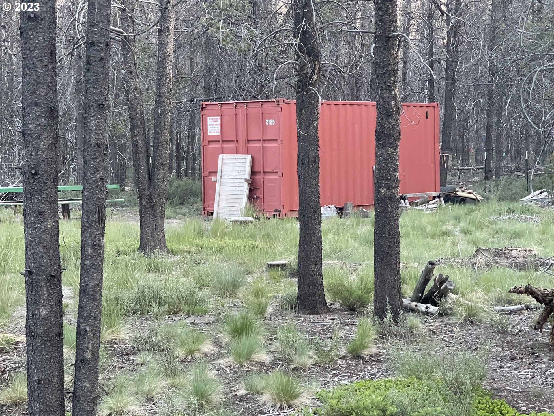 Priday Loop, Unit 23 Chiloquin, OR 97624 - Photo 12 of 21 a backyard of a house with lots of green space and fountain