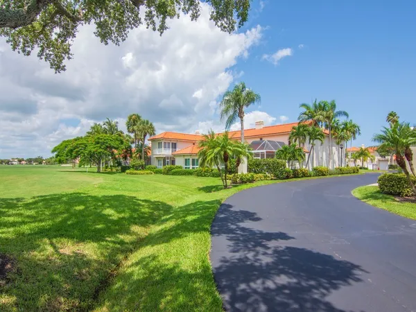 a view of a garden with a building in the background