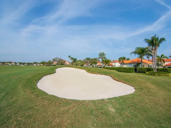 a view of a golf course with a garden