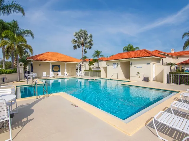 swimming pool view with a seating space