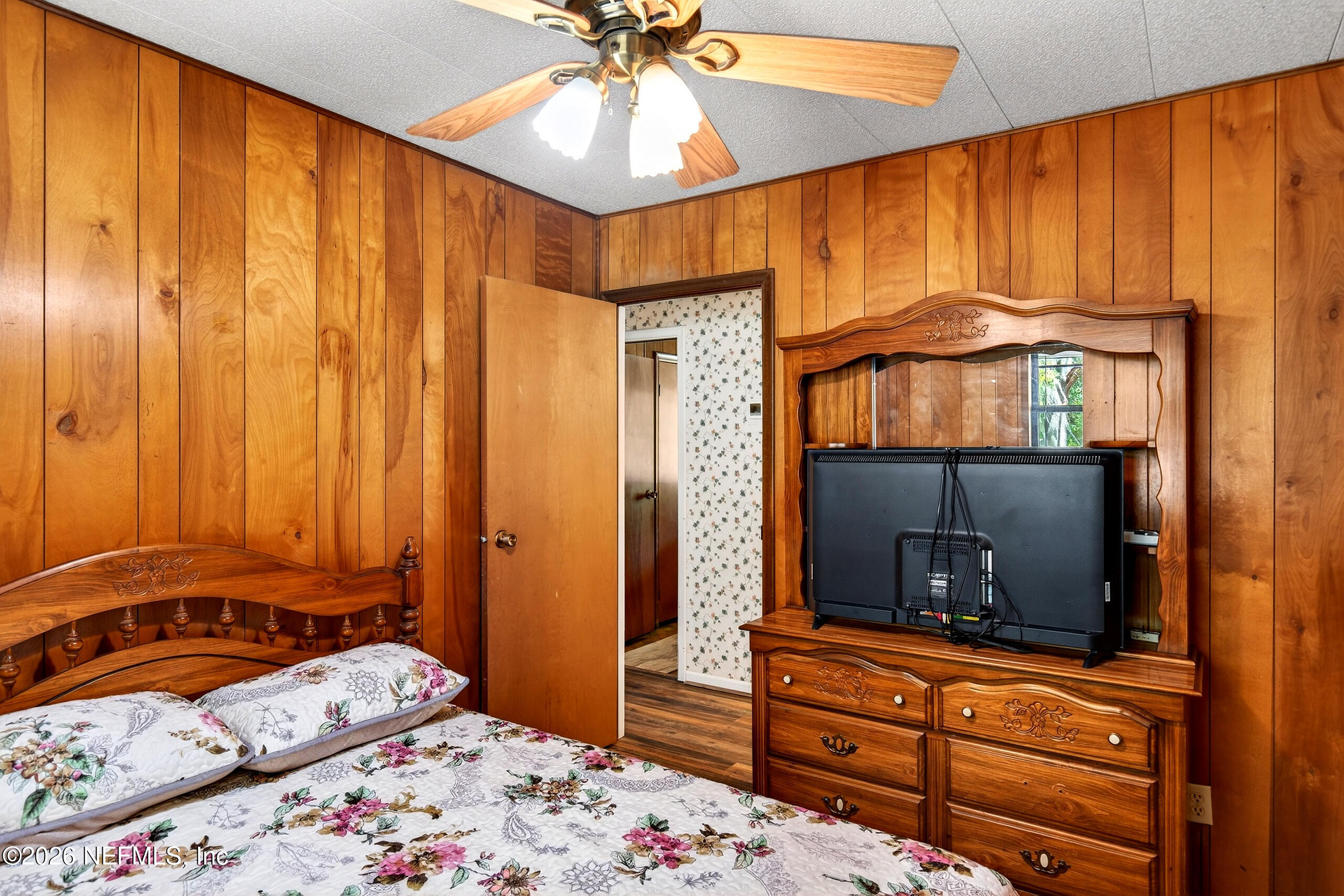 43122 Pineridge Drive Callahan, FL 32011 - Photo 17 of 46 a bedroom with a bed and a dresser