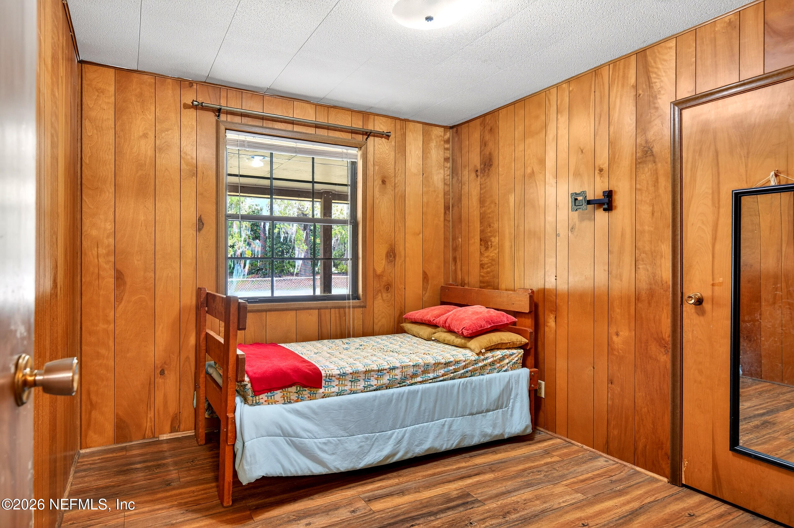 43122 Pineridge Drive Callahan, FL 32011 - Photo 19 of 46 a bedroom with a bed and a window