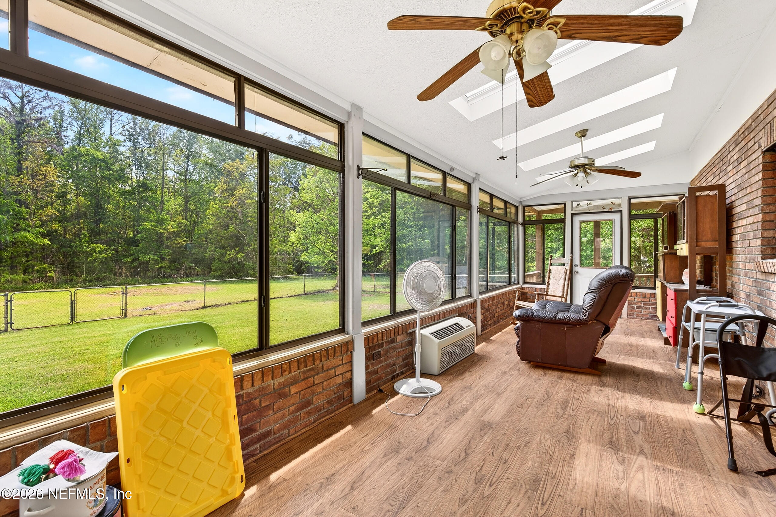43122 Pineridge Drive Callahan, FL 32011 - Photo 21 of 46 a living room with furniture and a large window