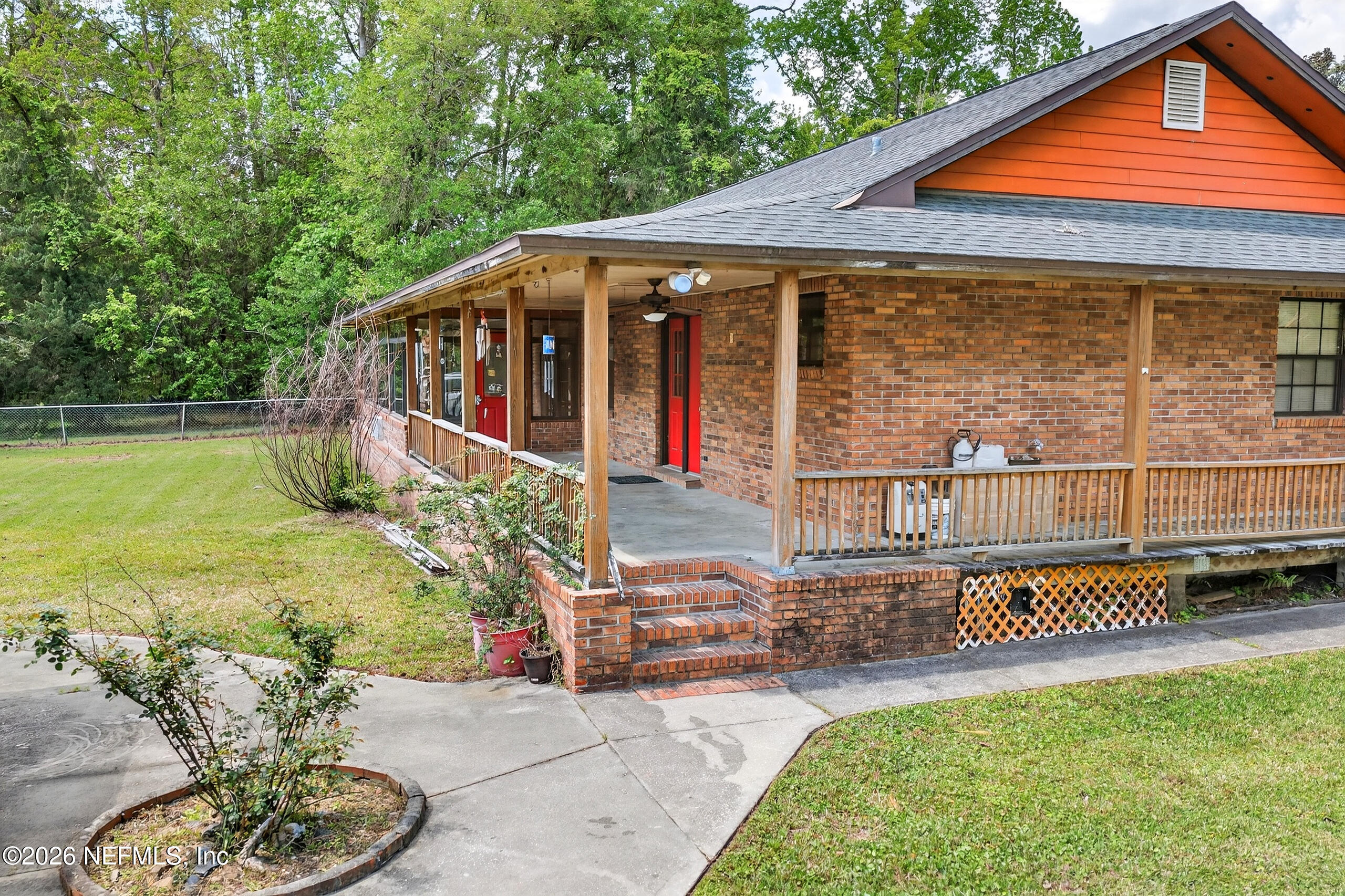 43122 Pineridge Drive Callahan, FL 32011 - Photo 23 of 46 a view of a house with backyard and sitting area