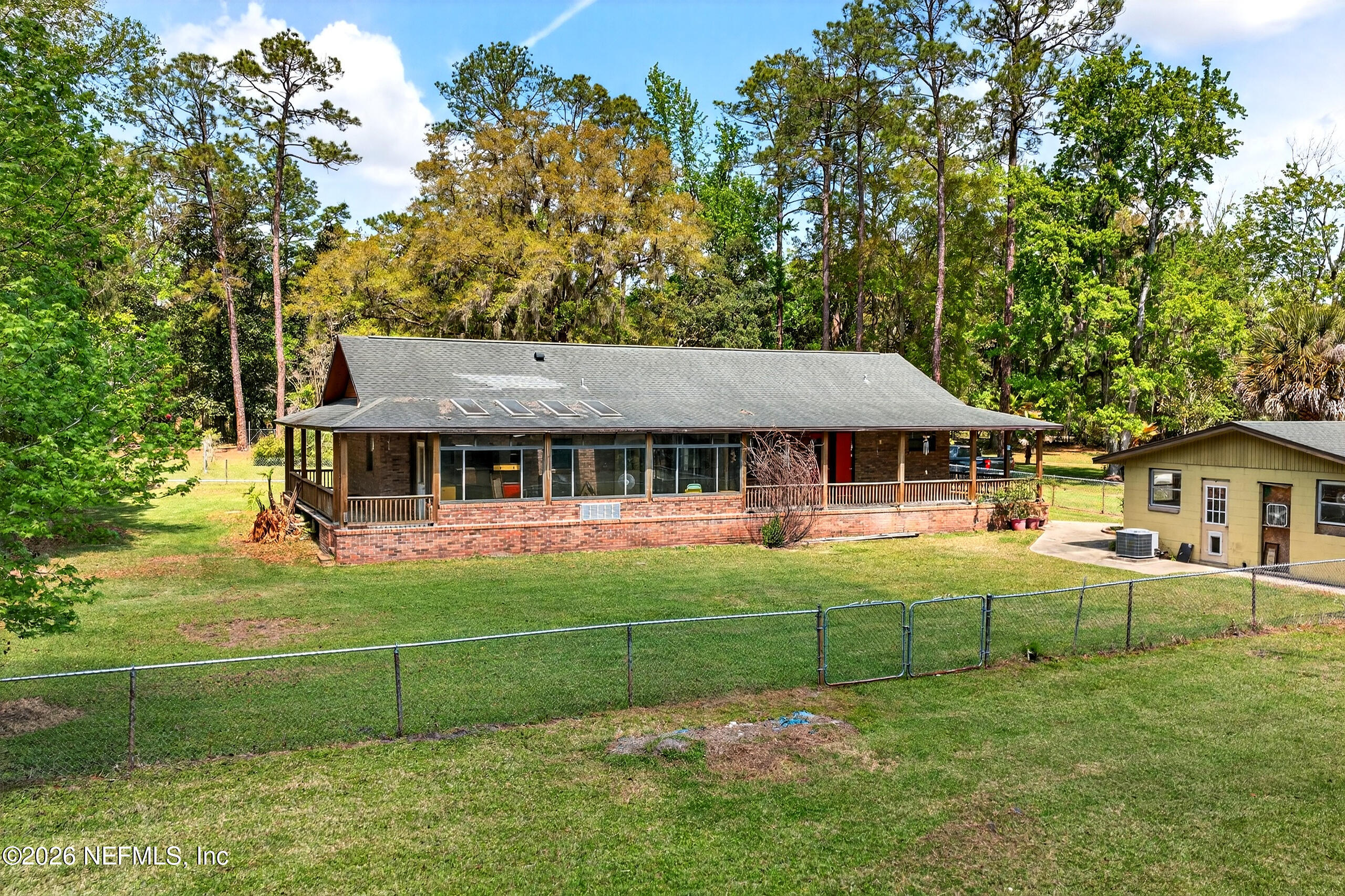 43122 Pineridge Drive Callahan, FL 32011 - Photo 24 of 46 a front view of a house with a garden