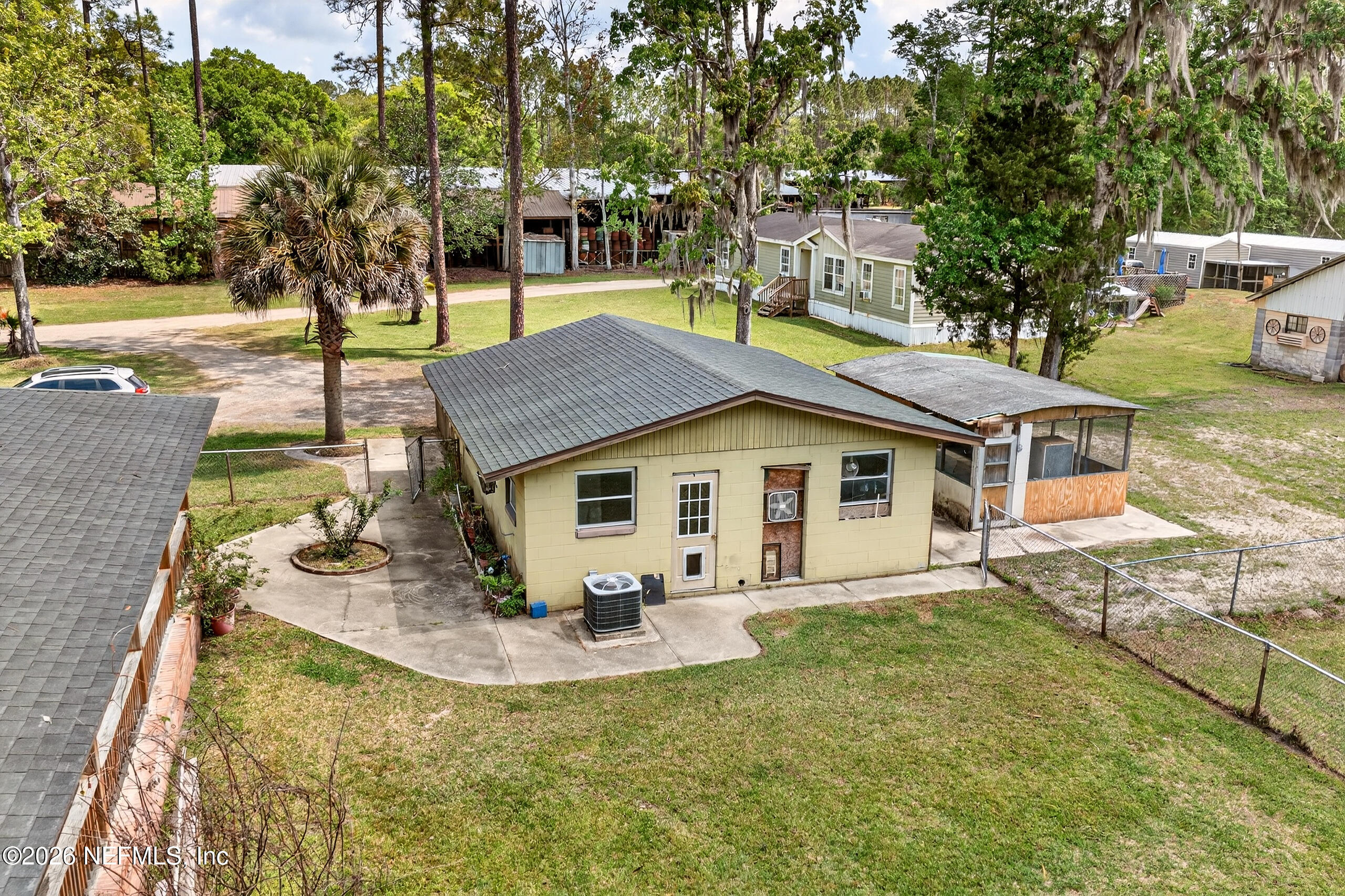 43122 Pineridge Drive Callahan, FL 32011 - Photo 25 of 46 a view of a house with backyard and sitting area