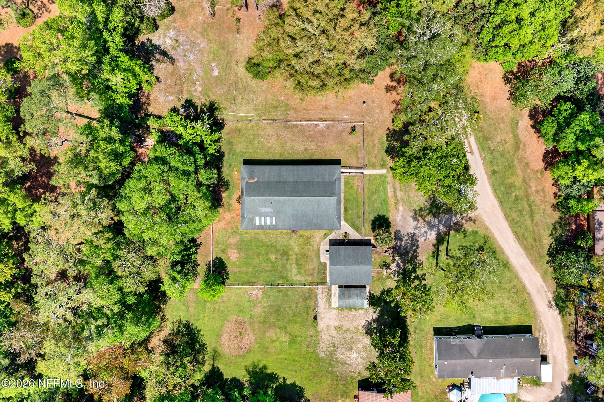 43122 Pineridge Drive Callahan, FL 32011 - Photo 29 of 46 an aerial view of a house with a yard