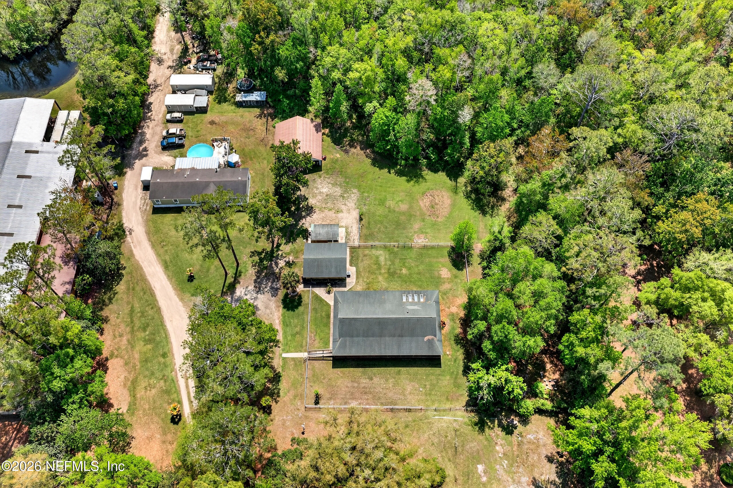 43122 Pineridge Drive Callahan, FL 32011 - Photo 30 of 46 an aerial view of a house with outdoor space