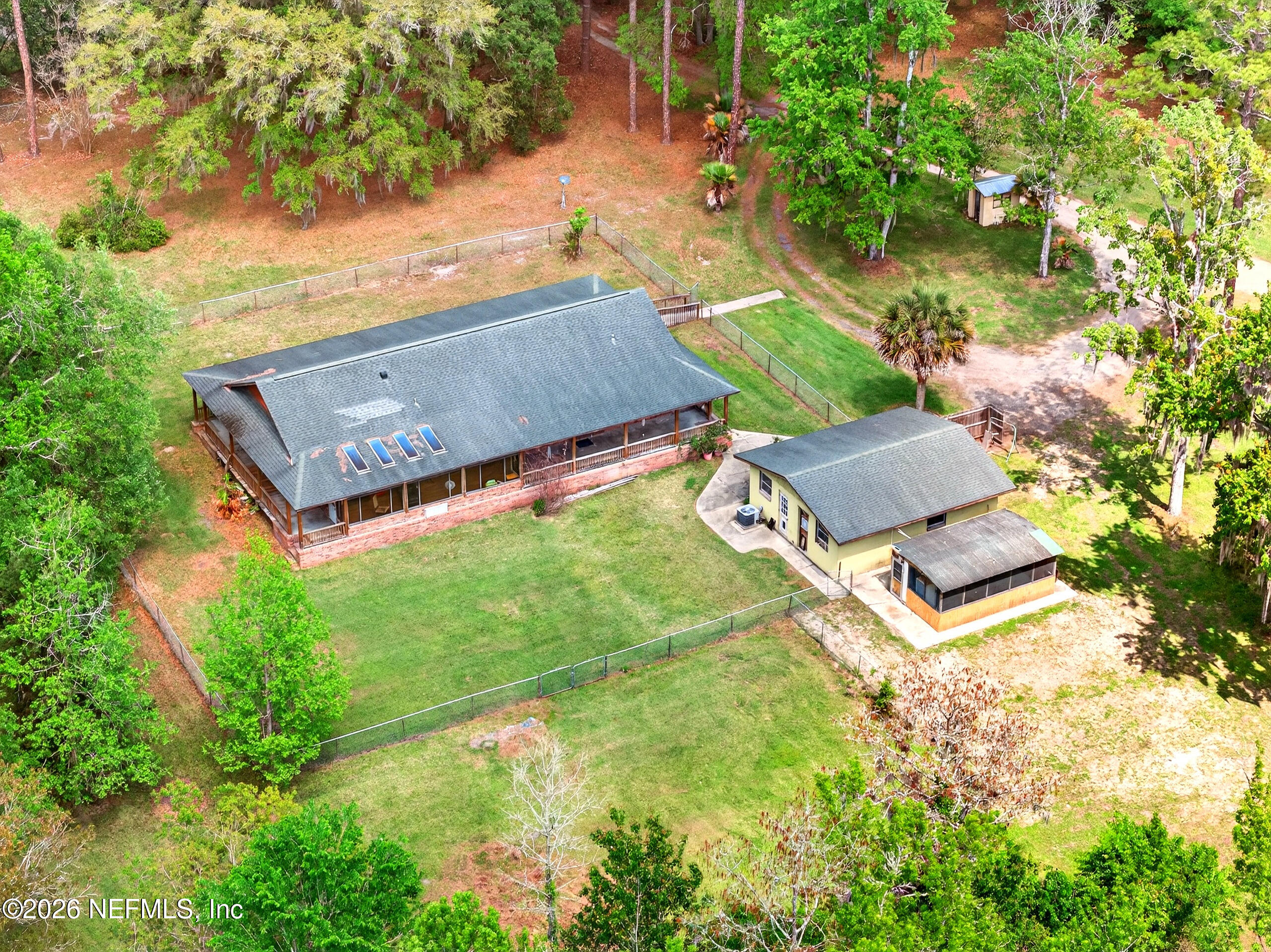 43122 Pineridge Drive Callahan, FL 32011 - Photo 3 of 46 an aerial view of a house with pool outdoor seating and yard