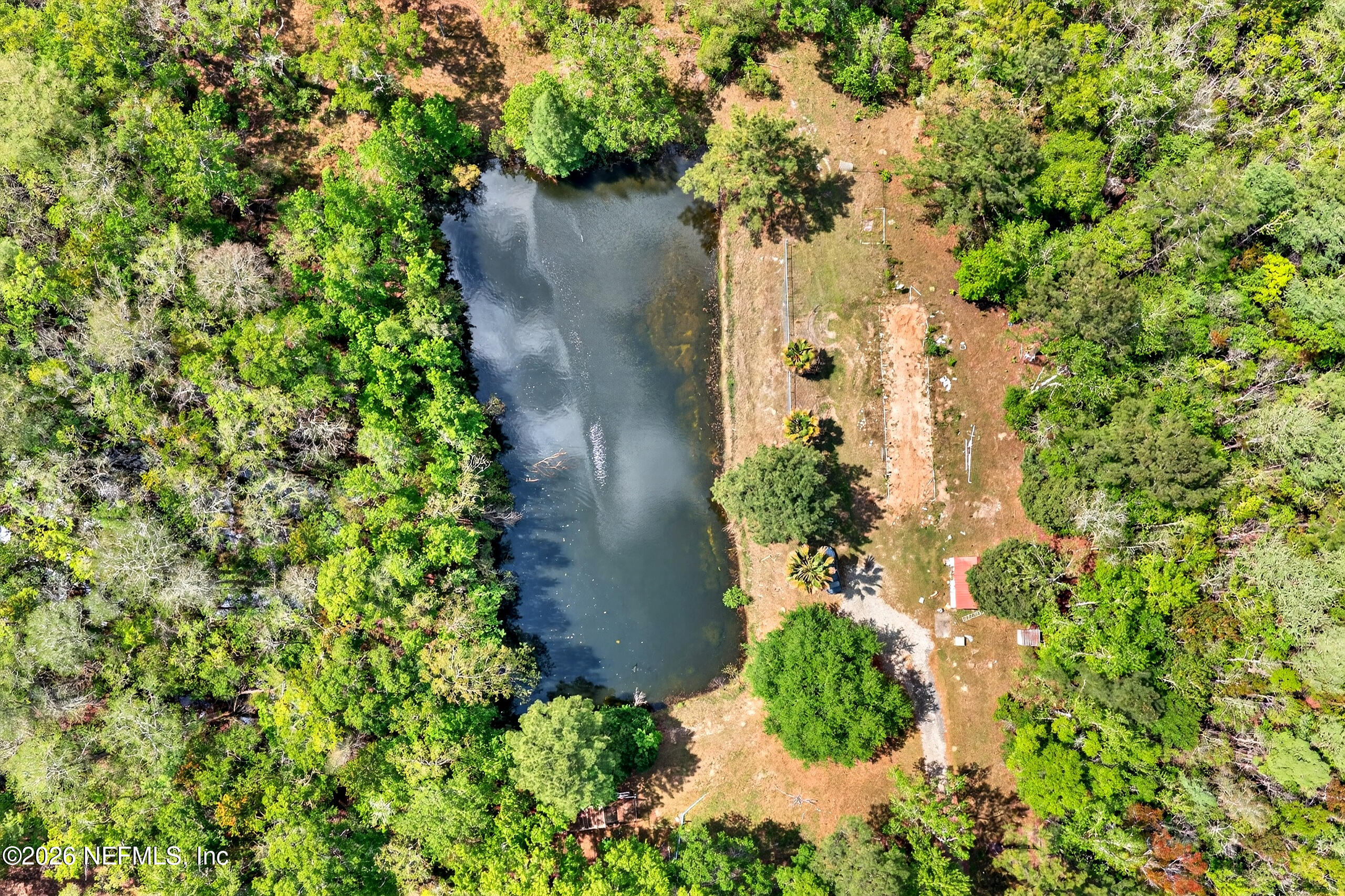 43122 Pineridge Drive Callahan, FL 32011 - Photo 33 of 46 an aerial view of a house with a yard and garden