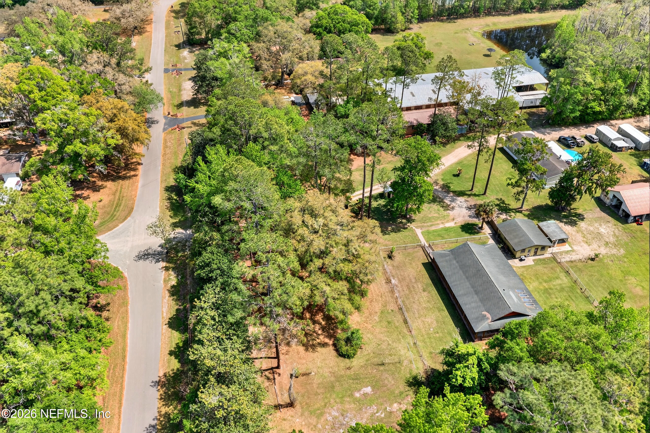 43122 Pineridge Drive Callahan, FL 32011 - Photo 45 of 46 an aerial view of residential house with outdoor space and swimming pool