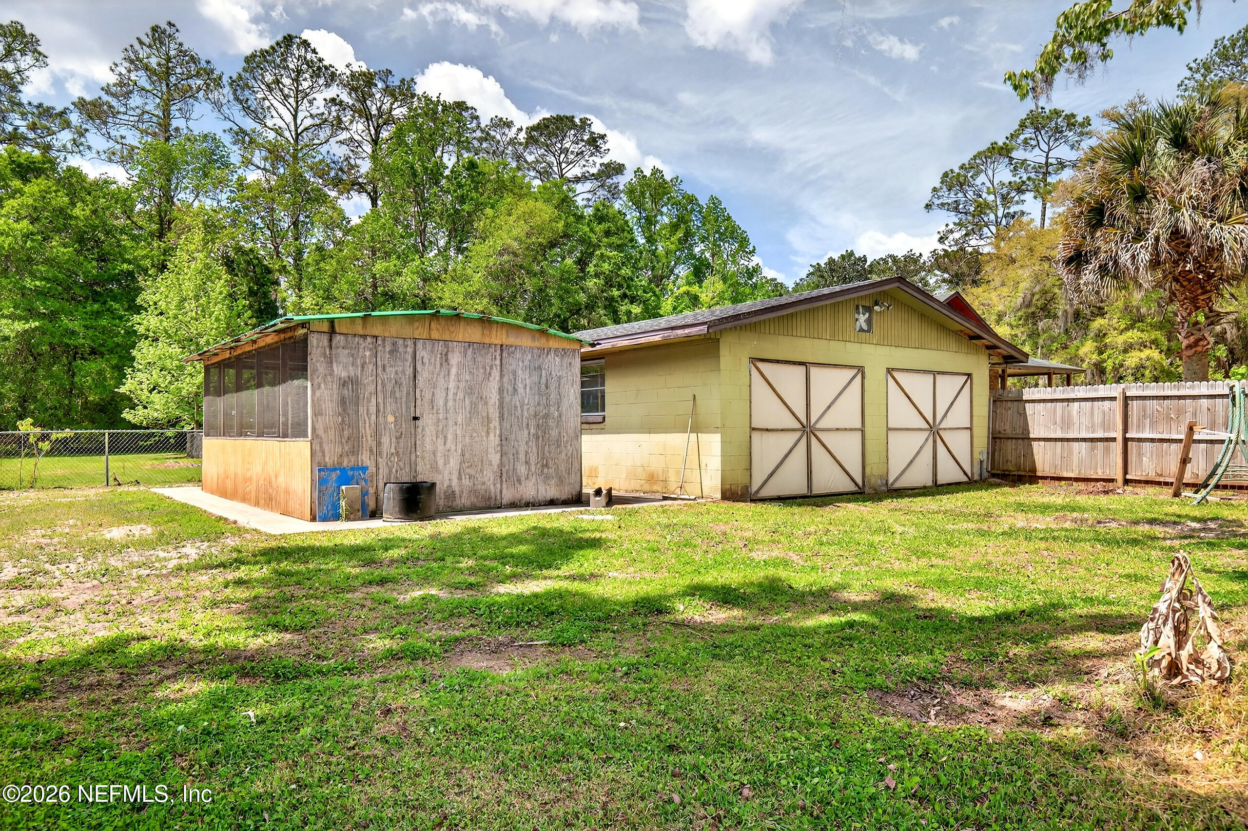 43122 Pineridge Drive Callahan, FL 32011 - Photo 5 of 46 a view of a house with a yard and garage