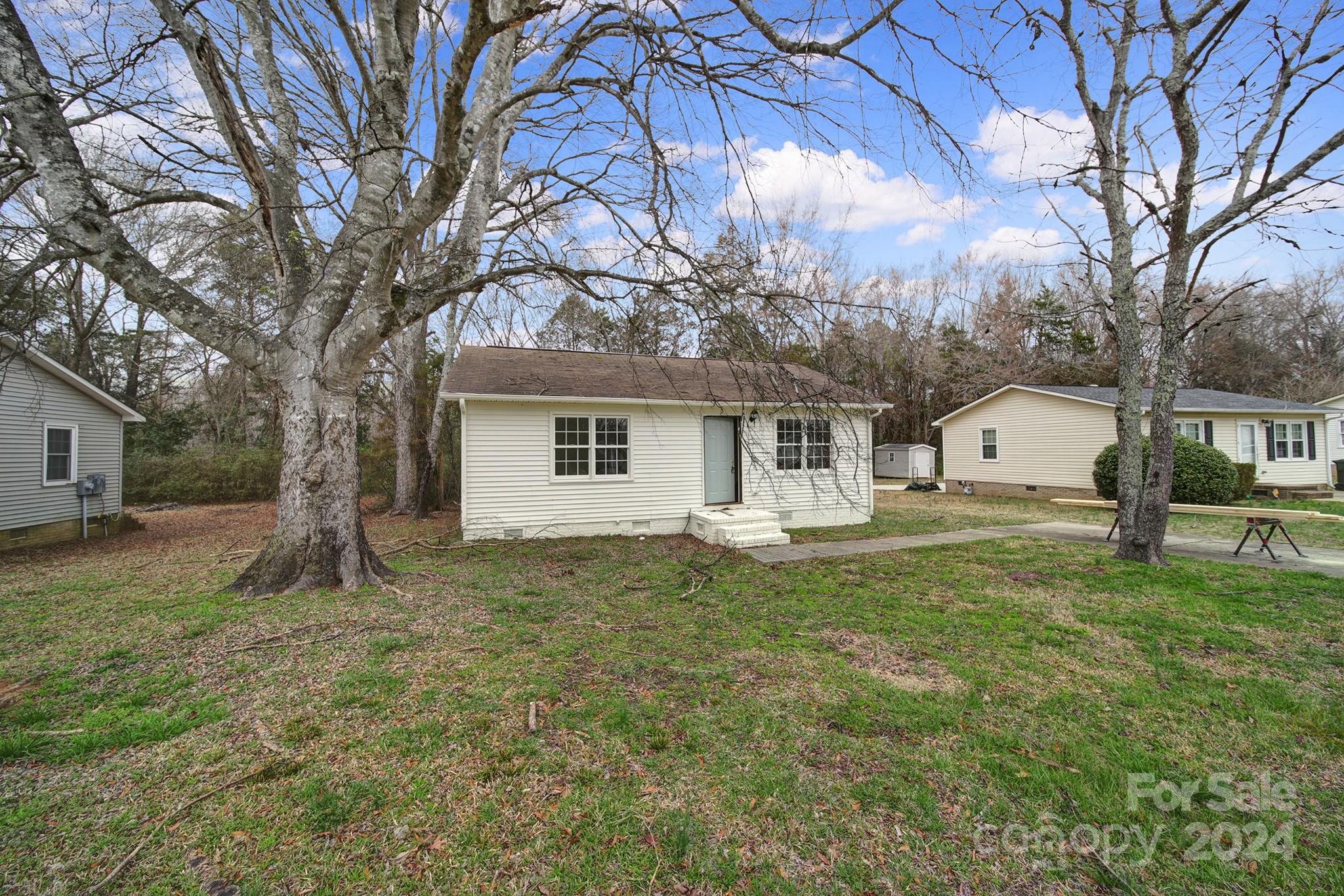 1958 Gilmore Road Rock Hill, SC 29730 - Photo 2 of 7 a house with trees in front of it