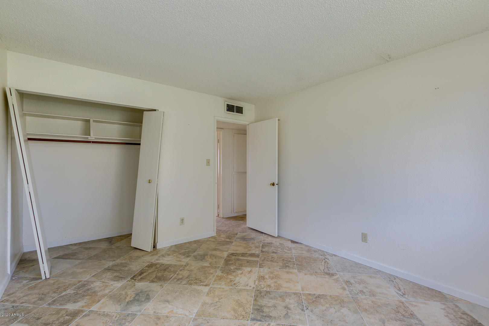 3210 West Calavar Road Phoenix, AZ 85053 - Photo 16 of 29 Master Bedroom