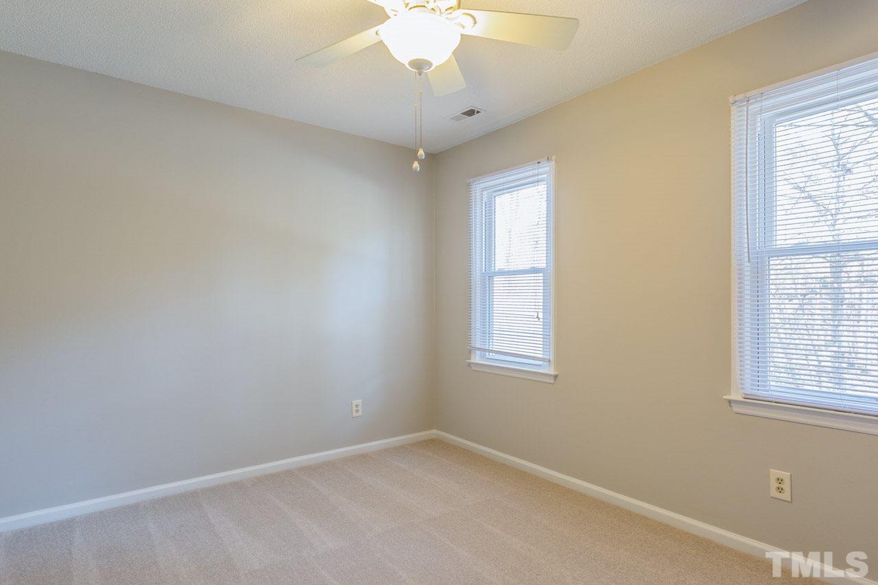307 Winterberry Ridge Drive Durham, NC 27713 - Photo 12 of 19 an empty room with a window