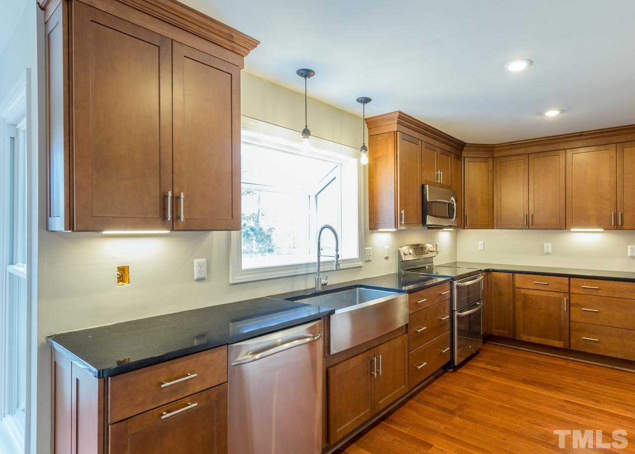 307 Winterberry Ridge Drive Durham, NC 27713 - Photo 6 of 19 a kitchen with sink cabinets and window