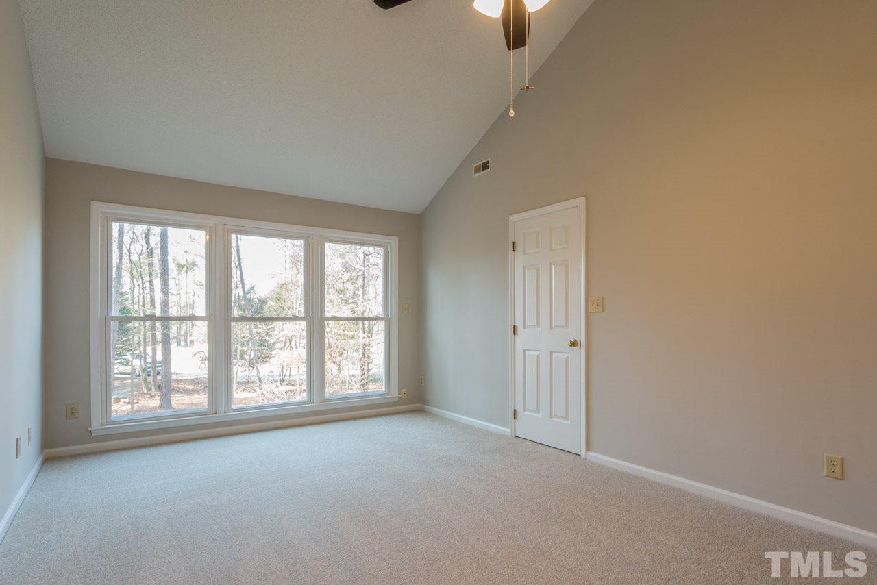 307 Winterberry Ridge Drive Durham, NC 27713 - Photo 9 of 19 an empty room with a empty space and windows