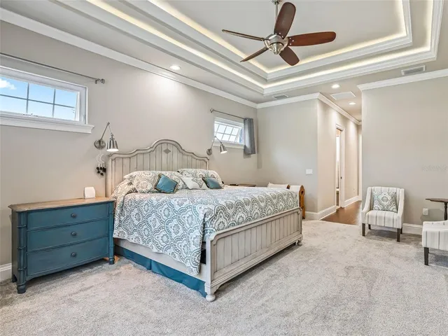 a bedroom with furniture window and wooden floor