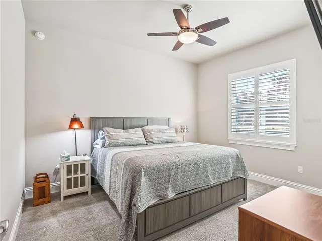 a view of a patio with table and chairs