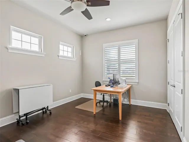 a view of backyard with swimming pool and outdoor seating