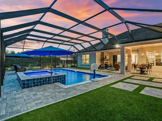 a view of a backyard with sitting area furniture and a yard