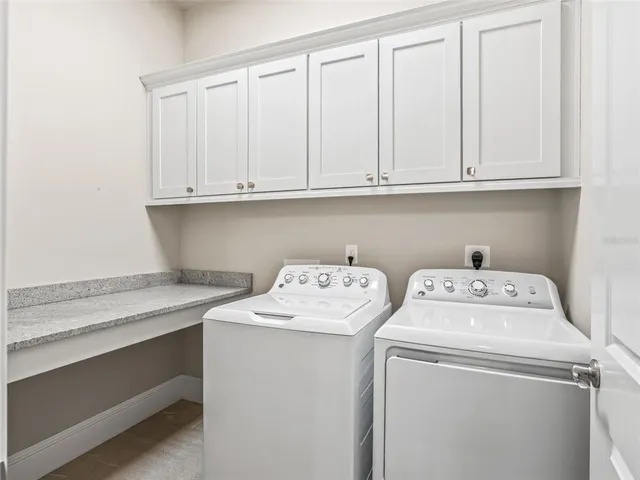 a view of a swimming pool with a couches in a patio