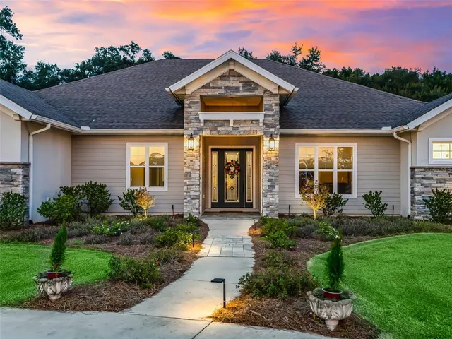 a living room with furniture a ceiling fan and a rug