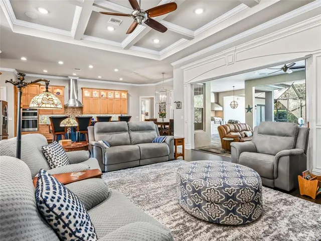 a kitchen with stainless steel appliances granite countertop a sink and wooden cabinets