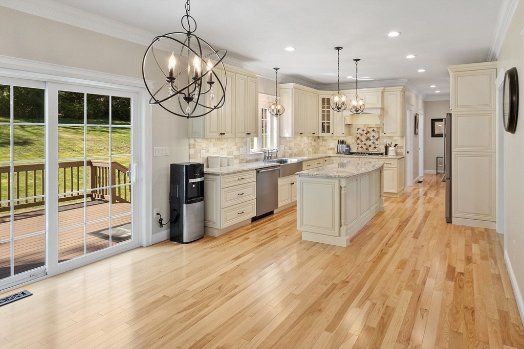 47 Fiske Mill Road Upton, MA 01568 - Photo 13 of 38 a large kitchen with lots of counter space a sink and stainless steel appliances
