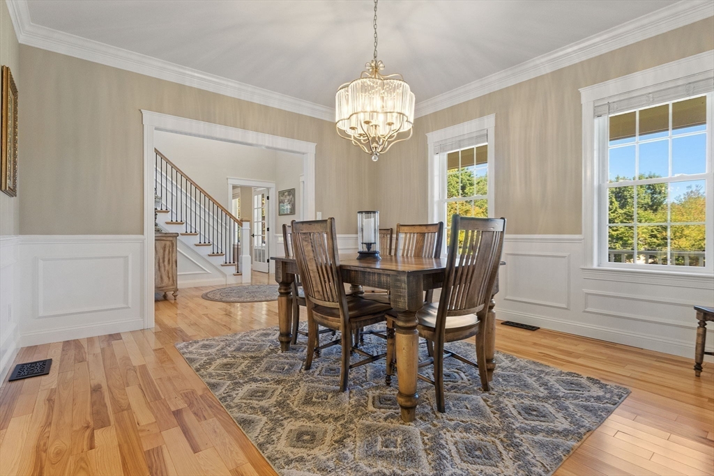 47 Fiske Mill Road Upton, MA 01568 - Photo 16 of 38 a view of a dining room with furniture window and wooden floor