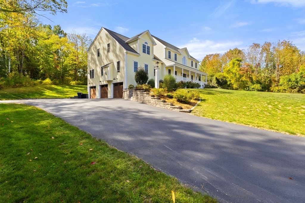 47 Fiske Mill Road Upton, MA 01568 - Photo 2 of 38 a very nice looking house with a big yard and large trees