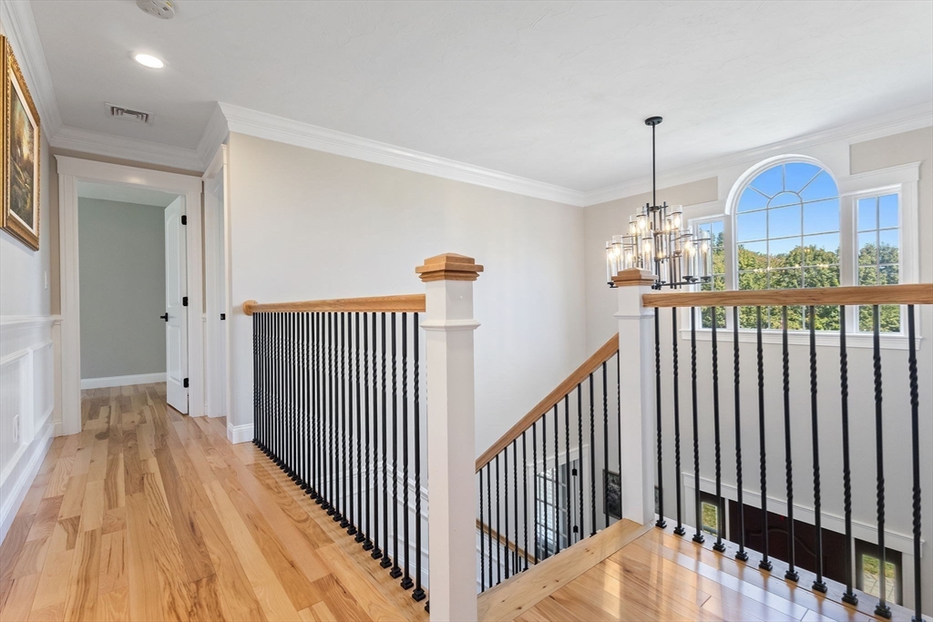 47 Fiske Mill Road Upton, MA 01568 - Photo 21 of 38 a view of a hallway with wooden floor and staircase