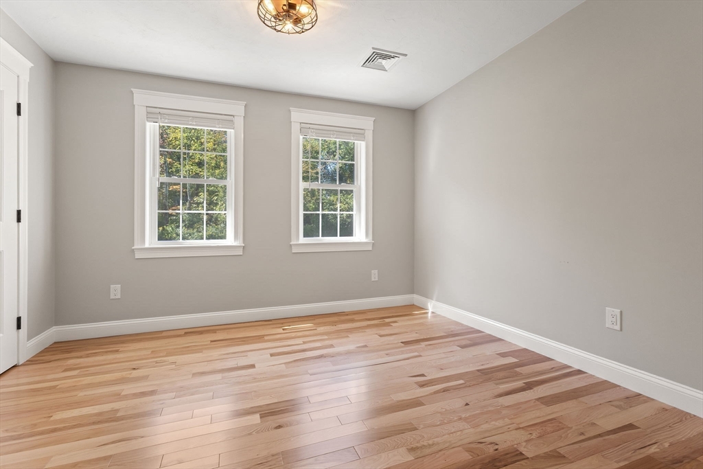 47 Fiske Mill Road Upton, MA 01568 - Photo 31 of 38 a view of empty room with wooden floor and fan