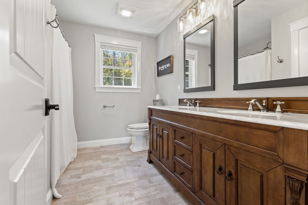 47 Fiske Mill Road Upton, MA 01568 - Photo 32 of 38 a spacious bathroom with sink and mirror