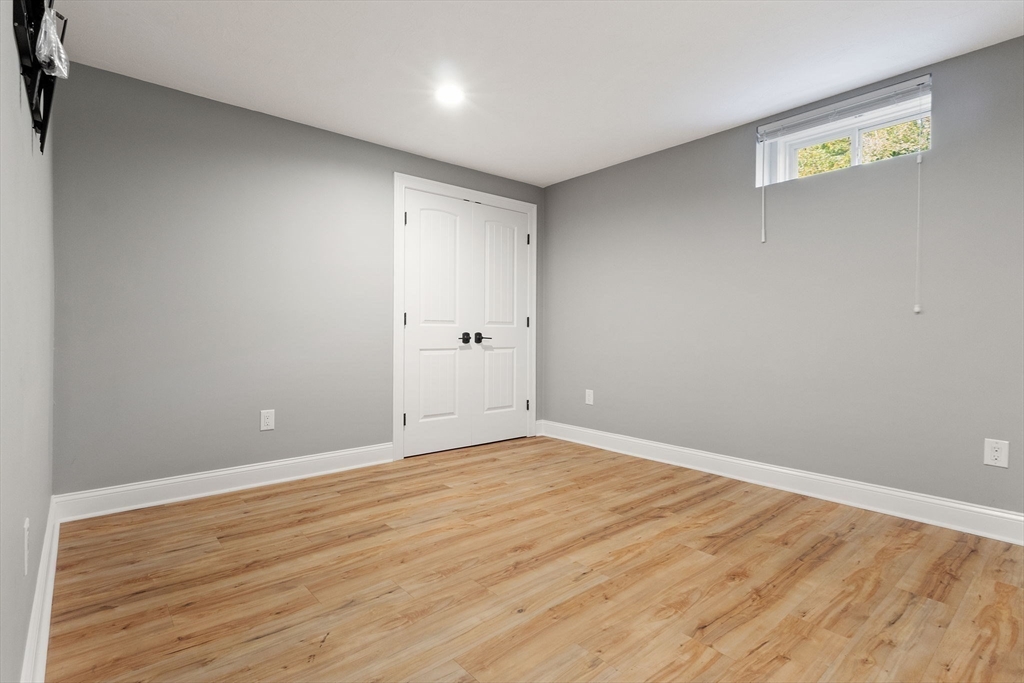 47 Fiske Mill Road Upton, MA 01568 - Photo 33 of 38 a view of an empty room with wooden floor