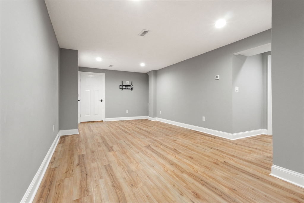 47 Fiske Mill Road Upton, MA 01568 - Photo 34 of 38 a view of an empty room with wooden floor