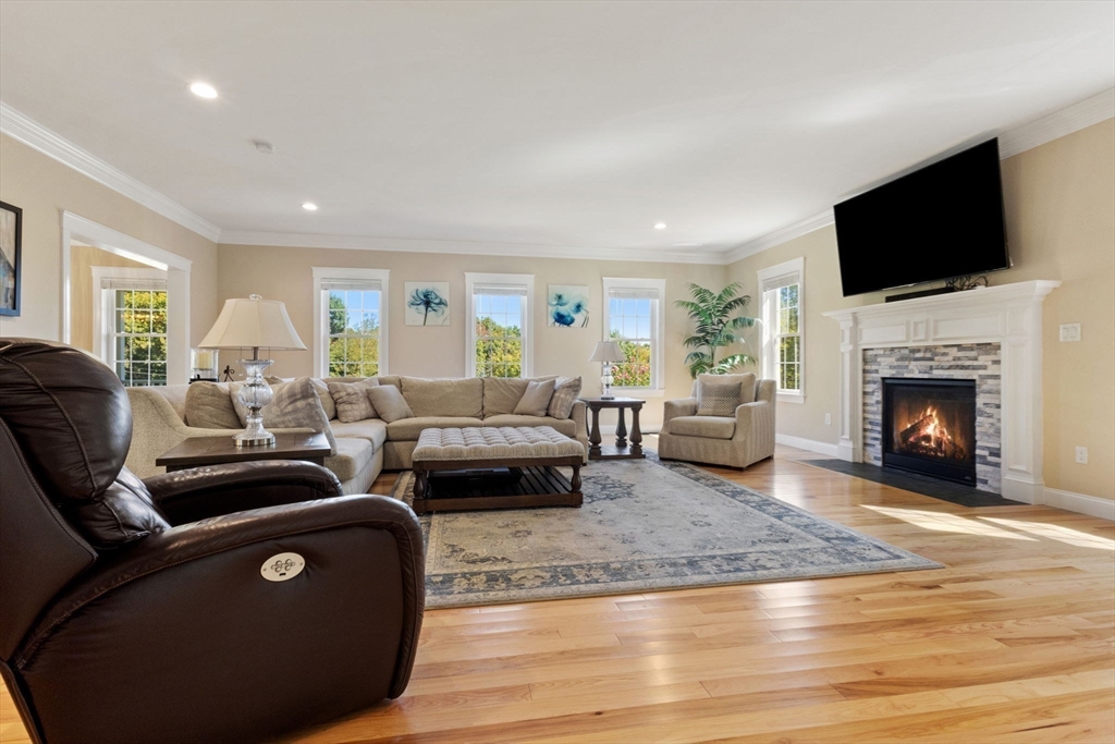 47 Fiske Mill Road Upton, MA 01568 - Photo 8 of 38 a living room with furniture and a fireplace